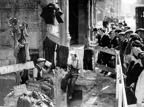 A 'No Coupon'sale taking place in a bombed out shop in Oxford Street