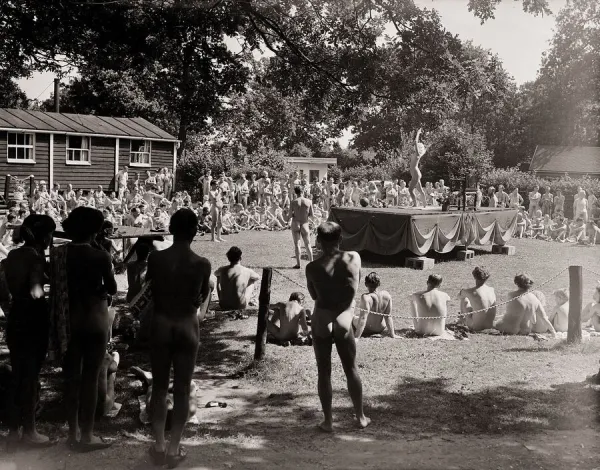 Nudist Beauty Contest - August 1957 people gather round a stage to view contestants