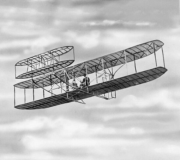 Orville Wright flying in the Wright flyer at Kittyhawk in the USA