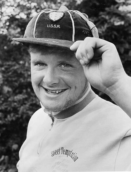 Paul Gascoigne proudly displays one of his under 21 caps as well as a touch of designer