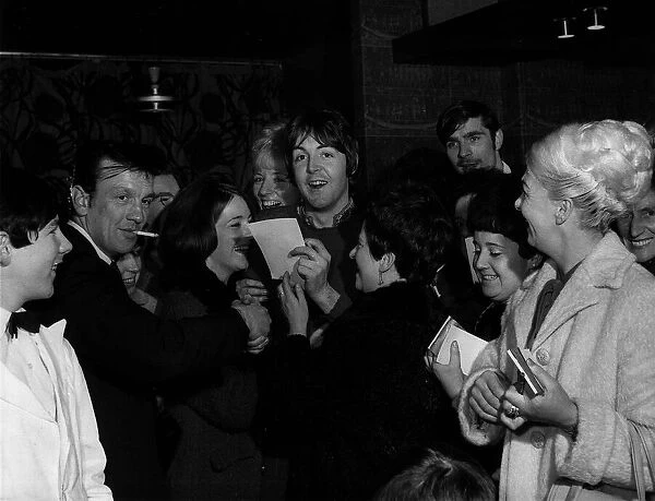 Paul McCartney signs autographs at a hotel in Glasgow where he