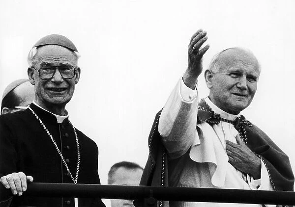 Pope John Paul II accompanied by Bishop, blesses congregation at Mass, Heaton Park