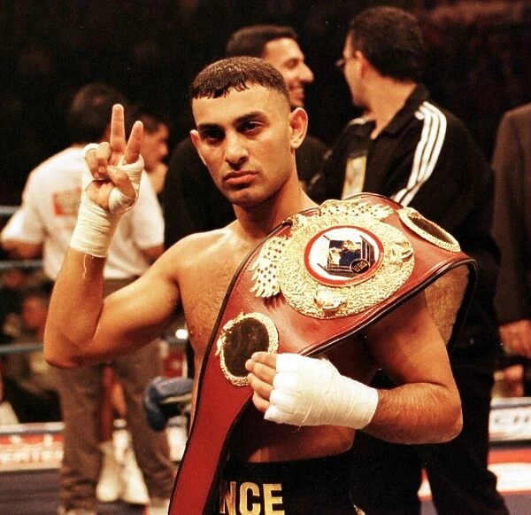 Prince Naseem Hamed gives victory sign after defeating Remigio Molina to retain his World