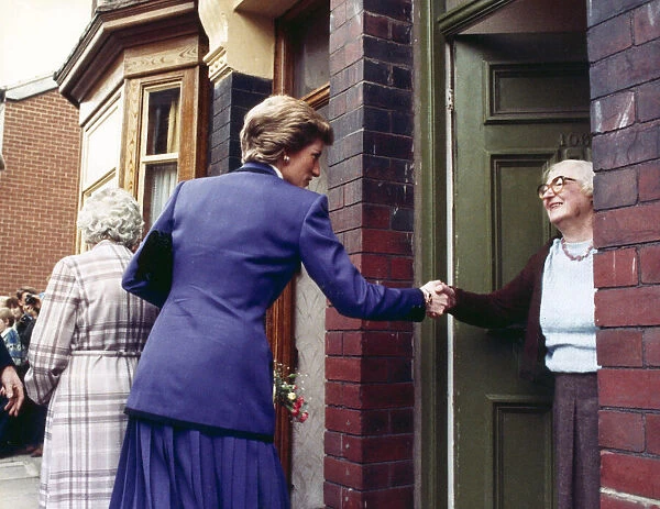 Princess Diana seen here shaking the hand of an elderly resident during her visit to