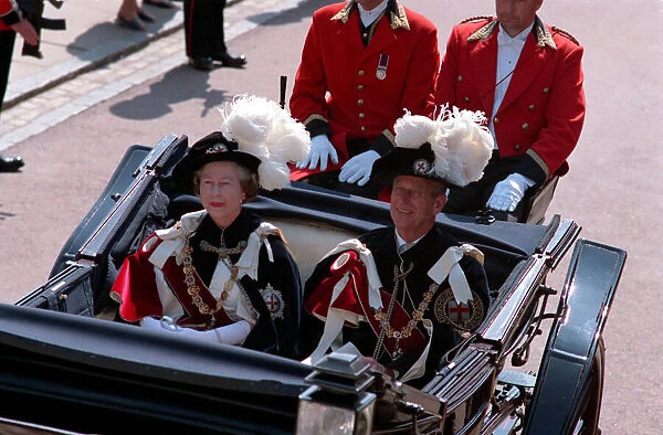 Queen Elizabeth II and Prince Philip riding in a Landau on their way to the Knights of