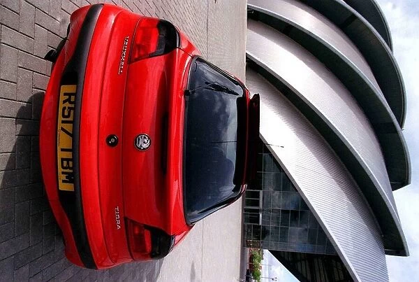 Red Vauxhall Tigra car May 1998 rear view outside Clyde Concert Hall Armadillo