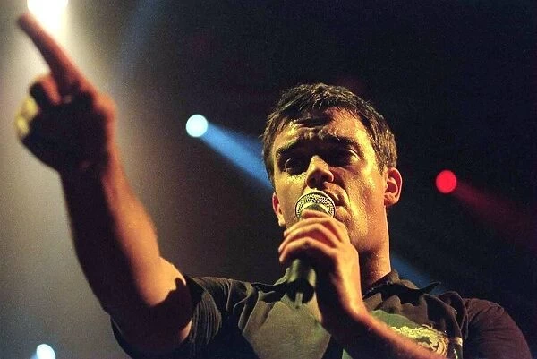 Robbie Williams sings at his concert in Aberdeen. February 1999