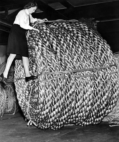 Rope making at a London factory. A huge coil of rope weighing three