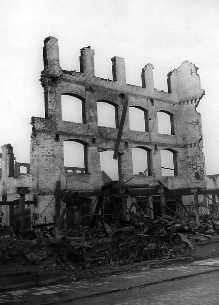 A scene from the suburb of Cheylesmore, Coventry, showing bomb damage to buildings