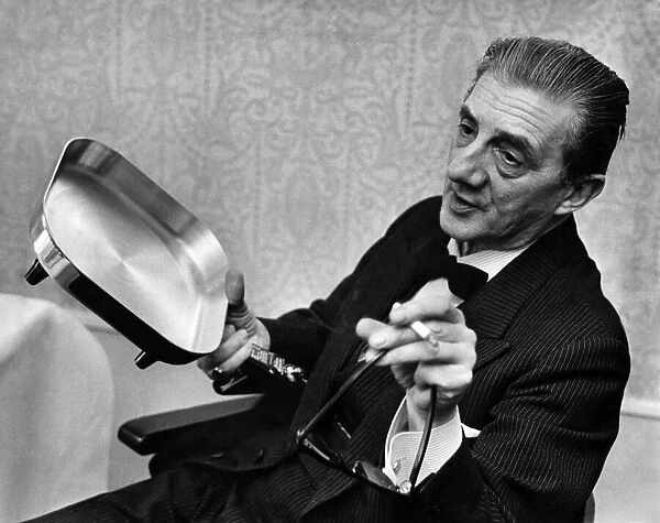 Sir John Barbirolli and his new frying pan. July 1964 P011488