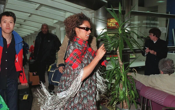 Spice Girls Mel B wearing a tartan scarf and sunglasses April 1998