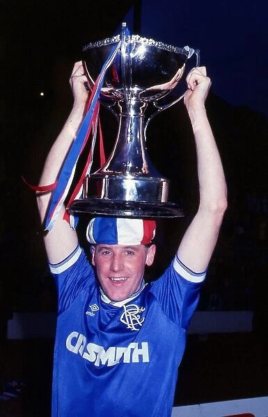 Ted McMinn with League Cup trophy on head October 1986