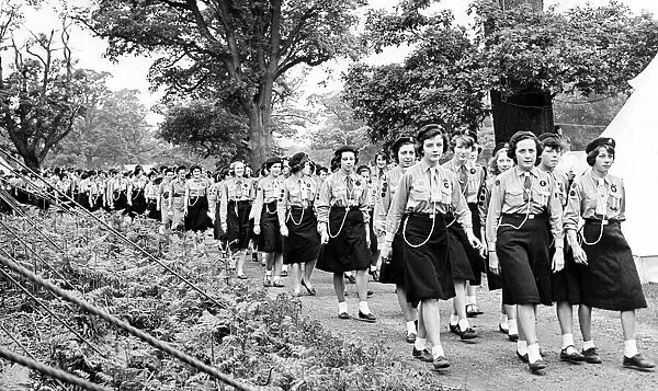 Warwickshire Girl Guide patrol leaders marching to a service held in their jubilee camp