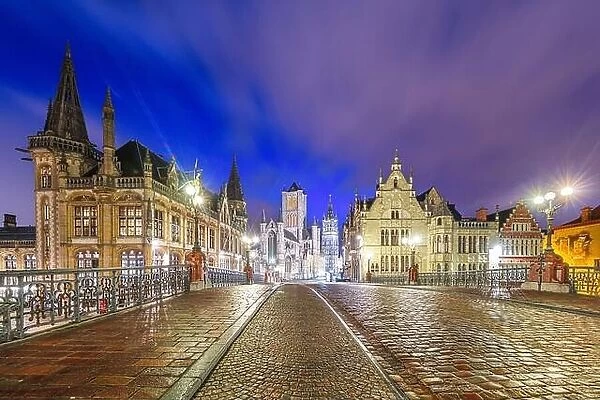 Ghent, Belgium old town cityscape from a bridge over the river at twilight