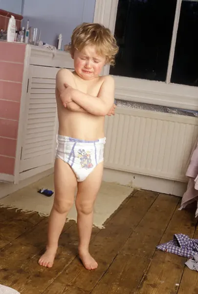 little boy standing in pull-ups in the bathroom Art