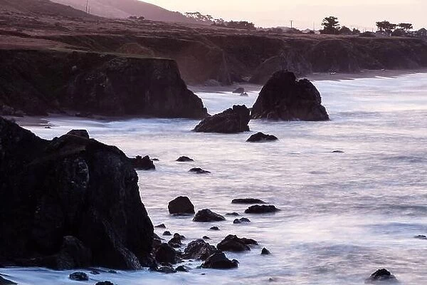 The Pacific Ocean washes against the rocky coastline of northern California in Sonoma. This region is often covered by a thick marine layer of mist