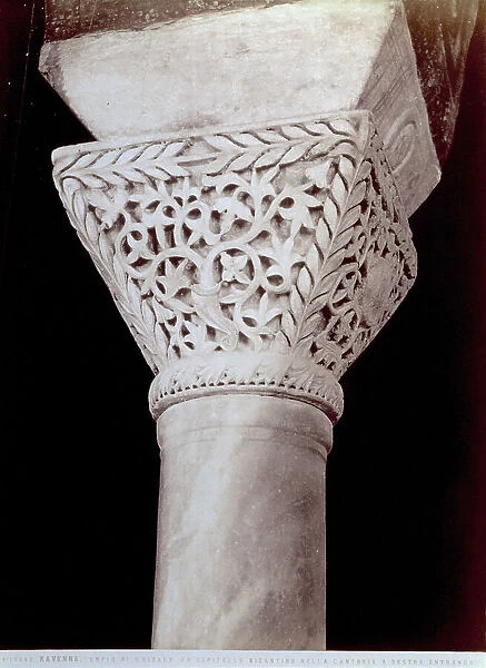 Capital sculpted with plant motifs, one of the two columns that support three arches, in the church of San Vitale in Ravenna