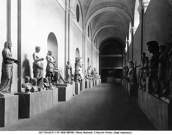 Emperor statues and busts in a corridor inside the National Archaeological Museum of Naples