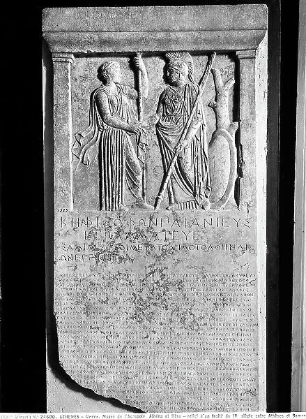 Greek Stele with the text of the fragmentary text of the agreement that took place in the V century B.C. between Athena and Samo. In the upper part of the bas-relief are the figures of Athena and Era
