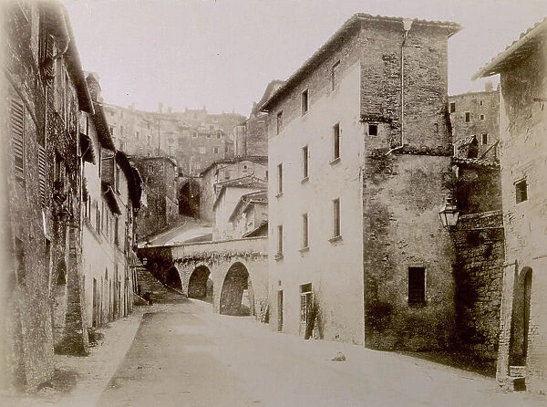 Houses and streets in the center of Perugia. Note the arches and a ramp which joins two levels of streets