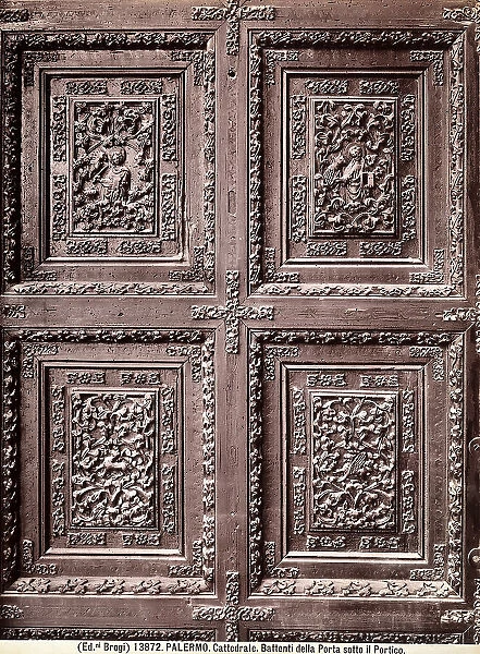 Some panels of the double doors of the portal located beneath the portico of Agrigento's Cathedral