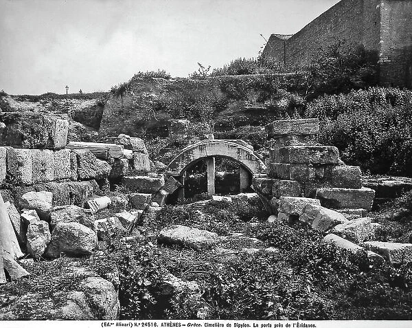 The picture portrays ruins of the door opening near the Eridano in the Cemetery of Dipylon. Athens