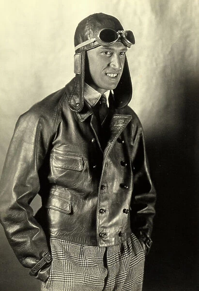 Portrait of a motorcyclist wearing a leather jacket and helmet