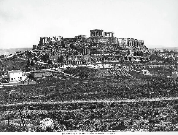 View of the acropolis of Athens: the photo shows a visual of fields with at the base of a sacred hill