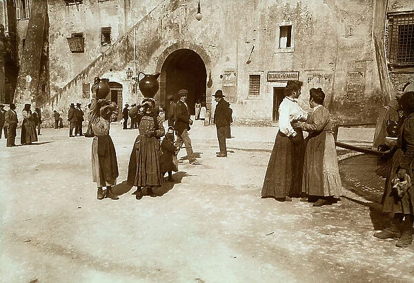 View with people of a street in Tarquinia