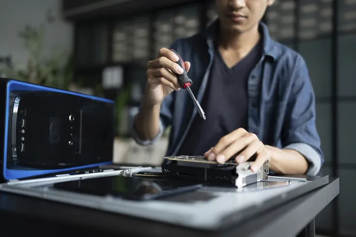 Framed Print : IT Engineer Installing Hardware Equipment Print