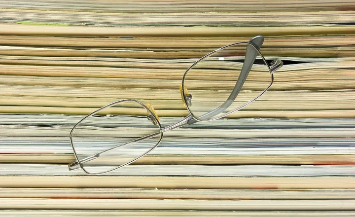 Framed Print : Glasses on Stack of Magazines Print Framed Print : Glasses on Stack of Magazines Print
