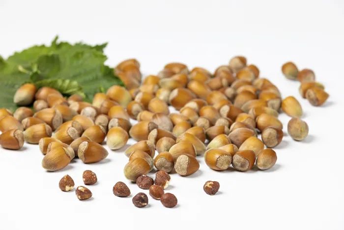 Framed Print : Hazelnuts in and without Shell Print on White Background