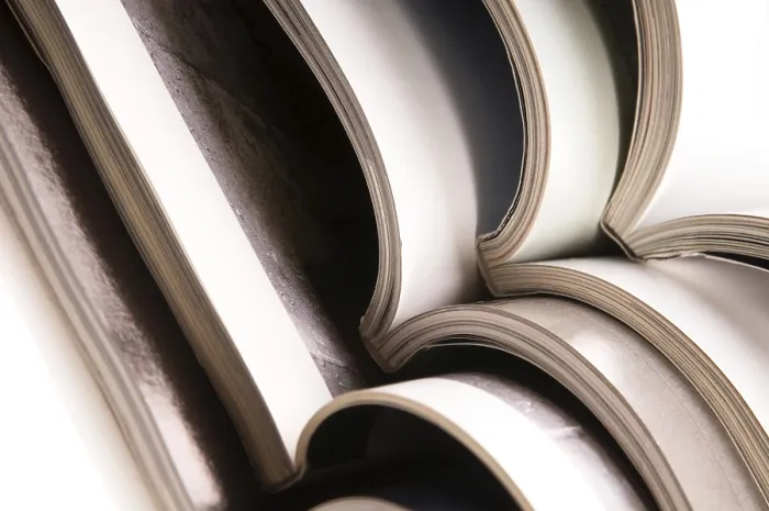Framed Print : Stack of Open Magazines Print Framed Print : Stack of Open Magazines Print