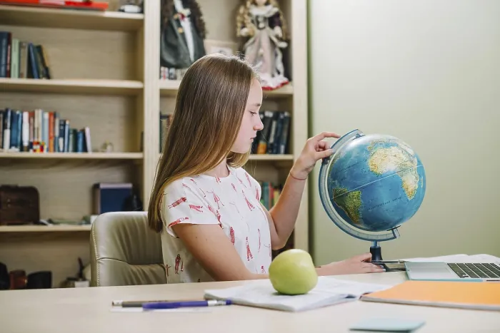 Framed Print : Student Posing with Globe Table Print