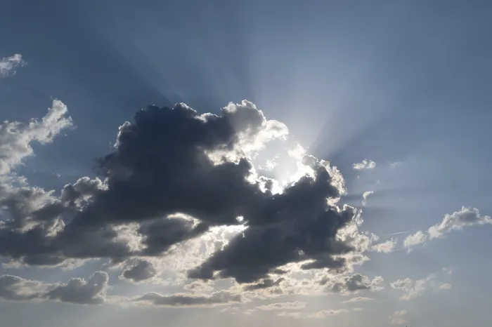 Framed Print : Sun behind a Cloud with Rays of Light Print