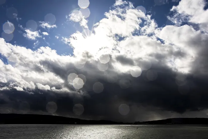 Framed Print : Sun Rays Break Through Clouds Print