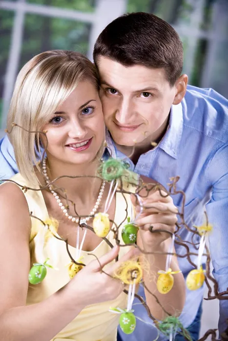 Framed Print : Young Couple Decorating for Easter Print Framed Print : Young Couple Decorating for Easter Print