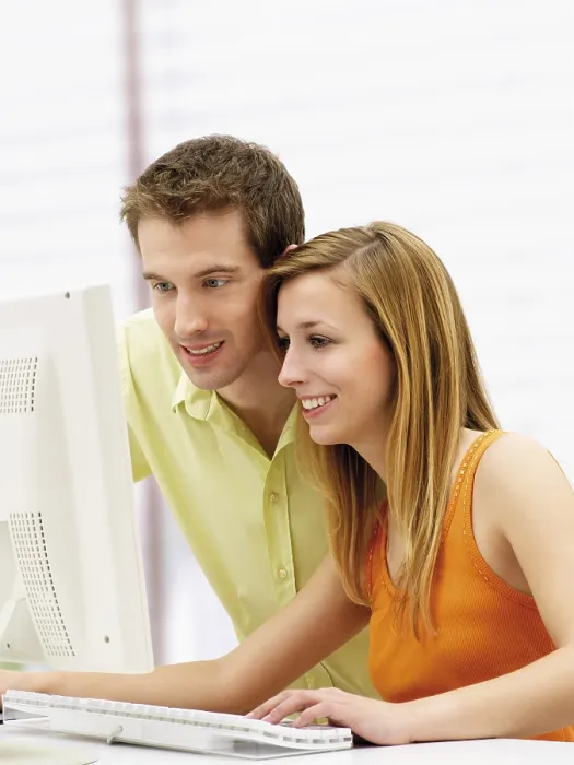 Framed Print : Young Couple Using a Computer Print Framed Print : Young Couple Using a Computer Print