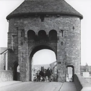 Monnow Bridge Print, a photograph of a man leading a horse and cart through the Monnow Gate Monnow Bridge Print, a photograph of a man leading a horse and cart through the Monnow Gate