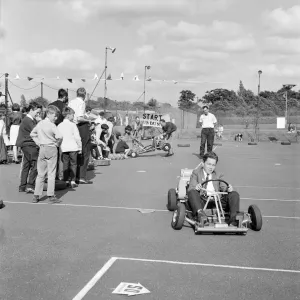 Print of Young Boys Participating in Go-Kart Racing at Laing Sports Ground Print of Young Boys Participating in Go-Kart Racing at Laing Sports Ground