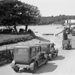 Cars and motorcycles arriving on board the ferry at Fishbourne, 1932