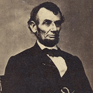 Abraham Lincoln, three-quarter length portrait, seated, faci
