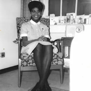 Black student nurse sitting in her room in Nottingham
