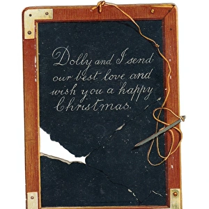 Childs slate with pen and greeting on a Christmas card