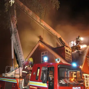 Firefighters working at scene of restaurant fire