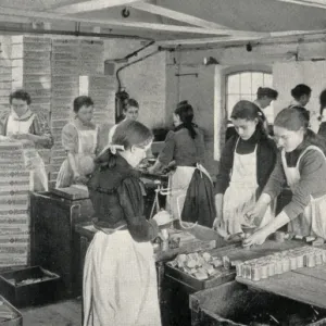 Girls filling penny tins of mustard, Norwich, Norfolk