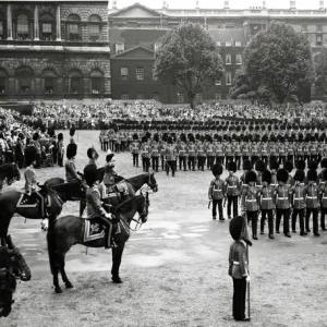 H. M. The Queen, in the scarlet of the Grenadiers