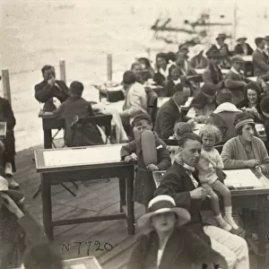 Holidaymakers on a British Pier - seated at tables