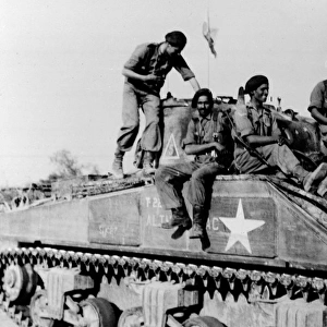Indian tank crew astride their Sherman tank