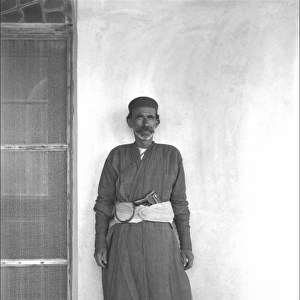 Iranian man with a gun in his belt